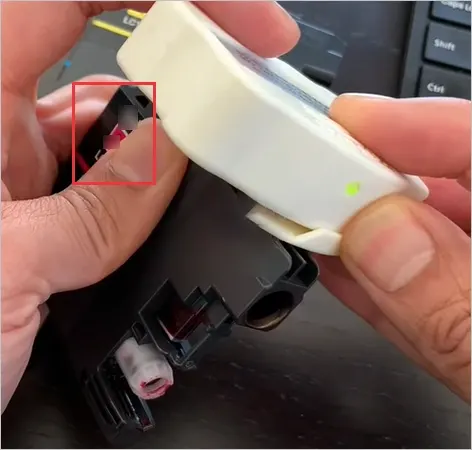 Press the reset chip and cartridge together